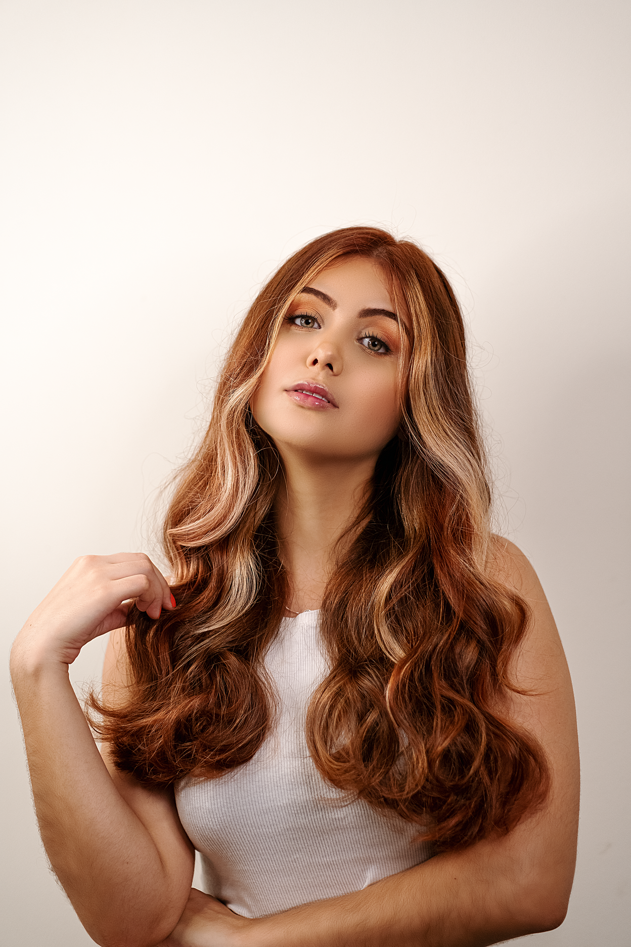 Woman With Blonde Hair Holding Her Hair